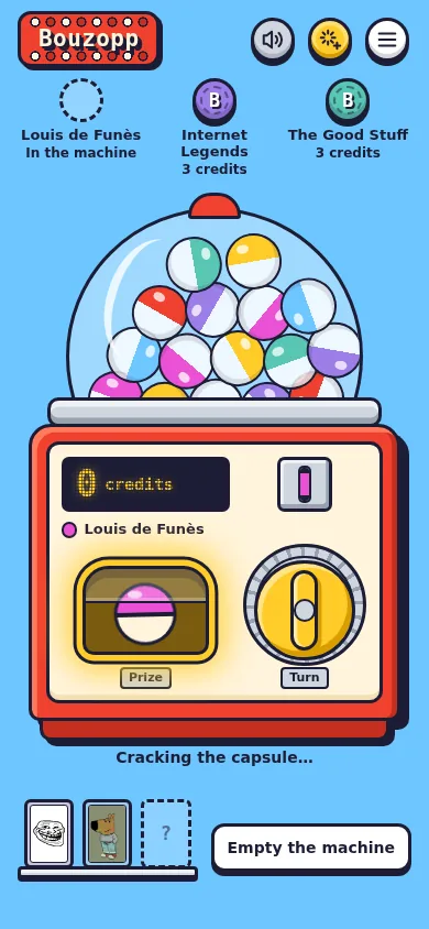 Capsule machine on a phone: tokens on top, the machine with its crank, the prize shelf below.